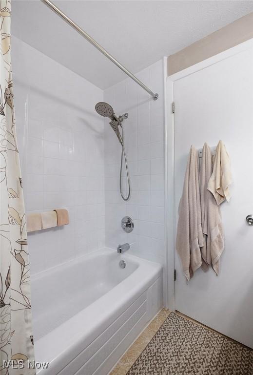 6122 Forest Ridge Dr, North Olmsted, OH 44070 - bathroom featuring shower / bath combo and tile patterned flooring