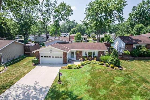 6122 Forest Ridge Dr, North Olmsted, OH 44070 - view of front of house featuring a garage, brick siding, driveway, a front yard, and a shingled roof