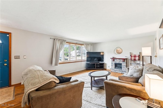 129 Whitman Blvd, Elyria, OH 44035 - living area featuring wood finished floors and a stone fireplace