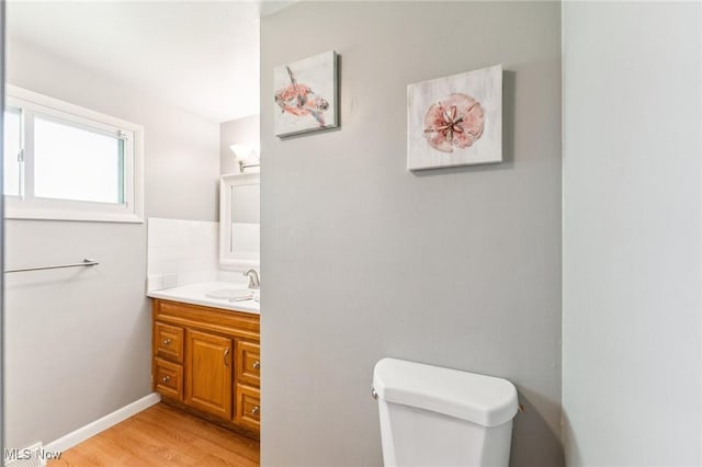 129 Whitman Blvd, Elyria, OH 44035 - half bathroom featuring vanity and wood finished floors
