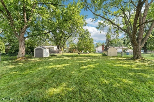 129 Whitman Blvd, Elyria, OH 44035 - fenced backyard featuring a storage shed