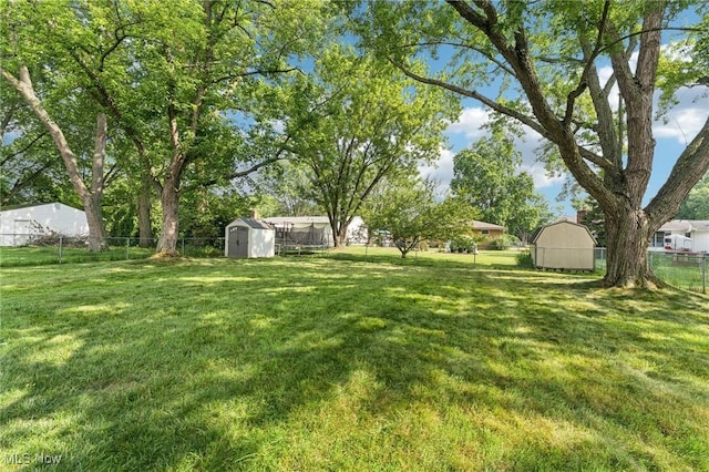 129 Whitman Blvd, Elyria, OH 44035 - fenced backyard featuring a storage shed