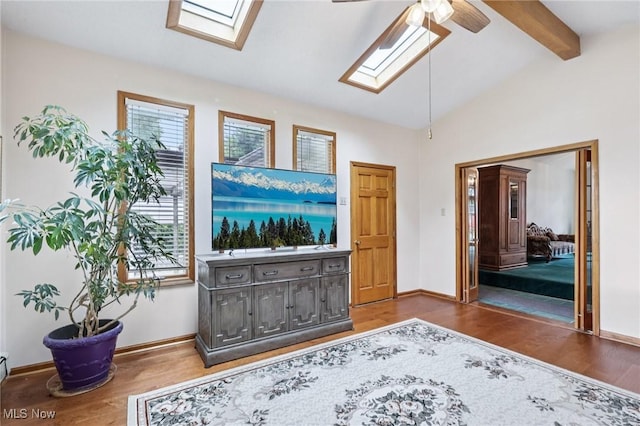 1318 Mirheath Dr, Huron, OH 44839 - living area with a skylight, a ceiling fan, and wood finished floors