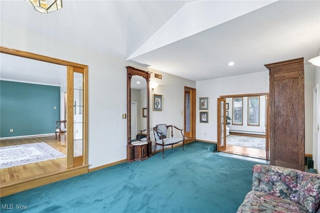 1318 Mirheath Dr, Huron, OH 44839 - sitting room with a baseboard heating unit, recessed lighting, lofted ceiling, and carpet