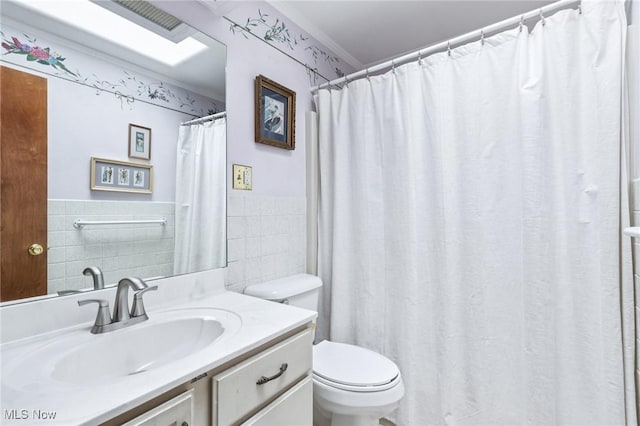 1318 Mirheath Dr, Huron, OH 44839 - bathroom featuring tile walls, vanity, a wainscoted wall, and a shower with shower curtain