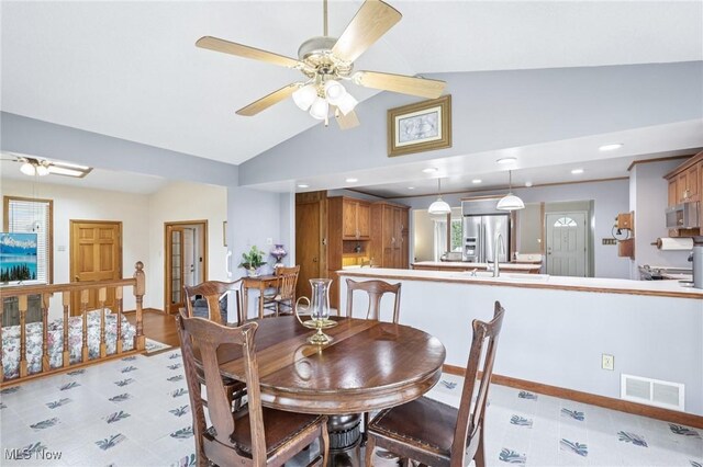 1318 Mirheath Dr, Huron, OH 44839 - dining area with a ceiling fan, vaulted ceiling, and recessed lighting