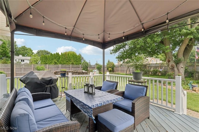 1318 Mirheath Dr, Huron, OH 44839 - wooden terrace featuring a fenced backyard, area for grilling, a gazebo, and outdoor lounge area