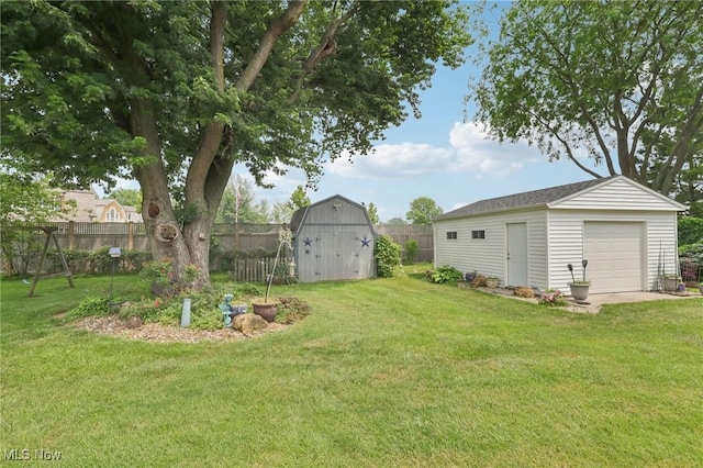 1318 Mirheath Dr, Huron, OH 44839 - fenced backyard with an outbuilding and a garage