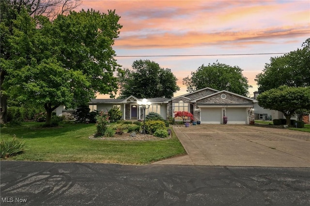 1318 Mirheath Dr, Huron, OH 44839 - single story home featuring an attached garage, concrete driveway, and a front yard