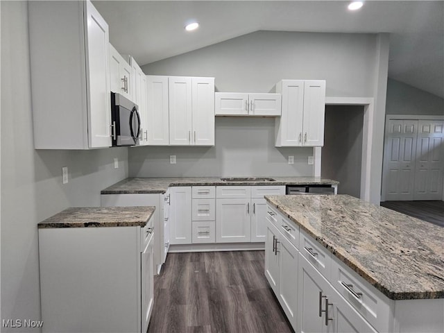 2500 Redgate Ln, Austintown, OH 44511 - kitchen featuring lofted ceiling, light stone countertops, dark wood-style floors, stainless steel gas stovetop, and white cabinets