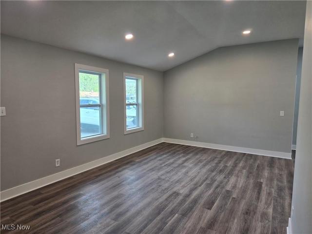2500 Redgate Ln, Austintown, OH 44511 - empty room with dark wood-type flooring, recessed lighting, and vaulted ceiling