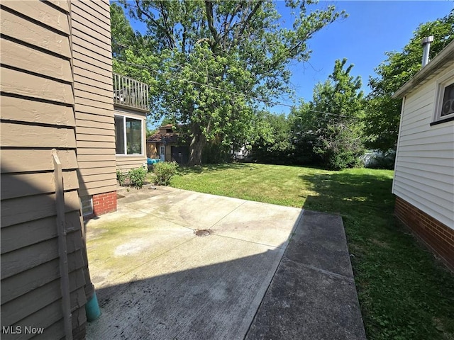 26313 Oriole Ave, Euclid, OH 44132 - view of green lawn with a patio and an outdoor structure