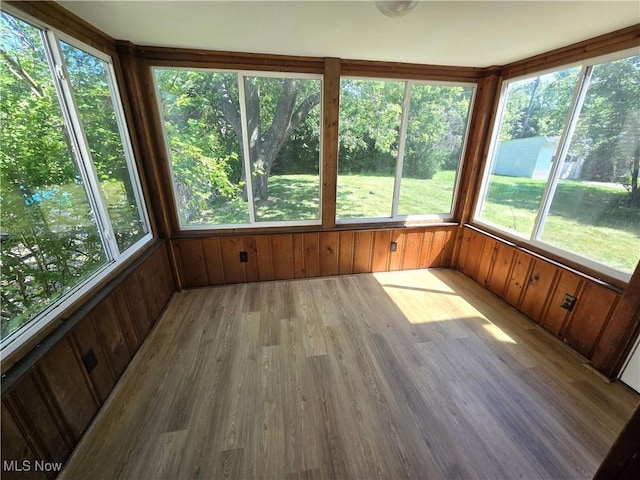 26313 Oriole Ave, Euclid, OH 44132 - unfurnished sunroom with wooden walls and wood finished floors