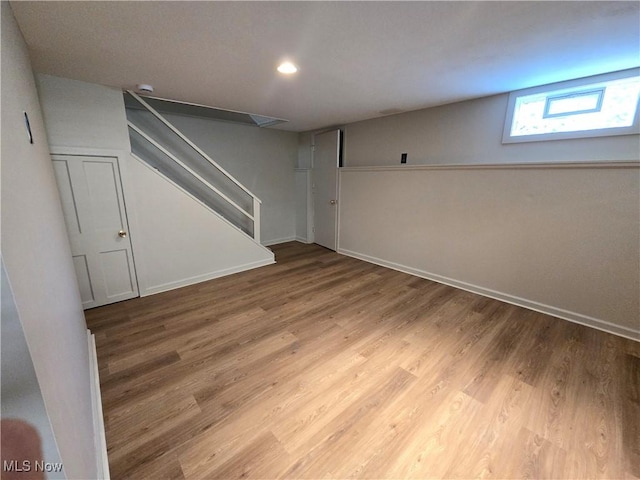 26313 Oriole Ave, Euclid, OH 44132 - below grade area featuring stairs, wood finished floors, and recessed lighting