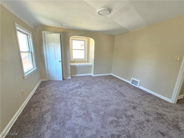 26313 Oriole Ave, Euclid, OH 44132 - unfurnished bedroom with carpet floors and arched walkways