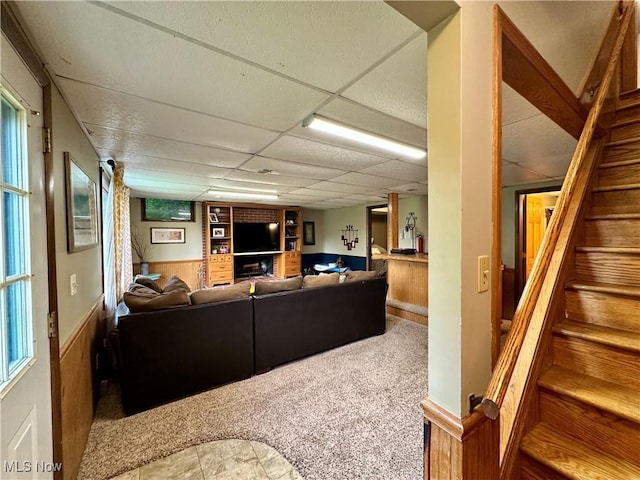 4145 Old River Rd, Philo, OH 43771 - carpeted living room with a paneled ceiling, wainscoting, and stairs