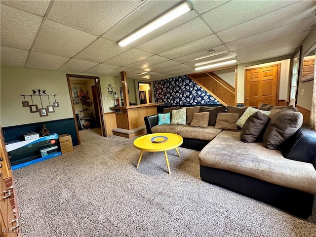 4145 Old River Rd, Philo, OH 43771 - carpeted living room with a paneled ceiling, stairway, and bar