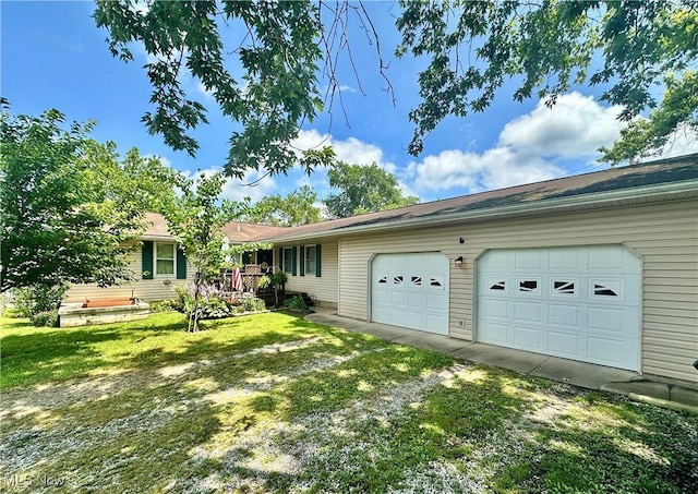 4145 Old River Rd, Philo, OH 43771 - view of front of house with an attached garage, driveway, and a front lawn