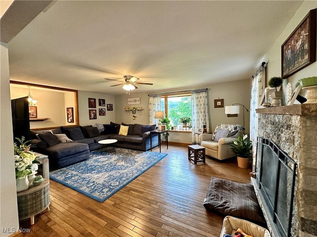 4145 Old River Rd, Philo, OH 43771 - living area with a stone fireplace, hardwood / wood-style flooring, and ceiling fan