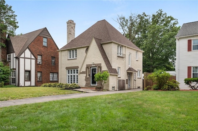 18112 Lomond Blvd, Shaker Heights, OH 44122 - view of front of house with brick siding, a chimney, and a shingled roof