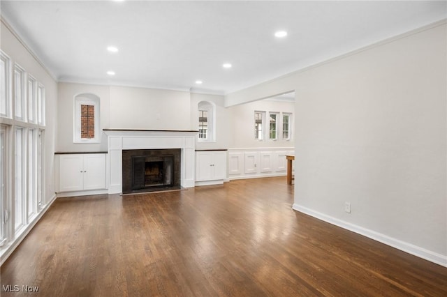 18112 Lomond Blvd, Shaker Heights, OH 44122 - unfurnished living room with wood finished floors, a fireplace with flush hearth, recessed lighting, and crown molding