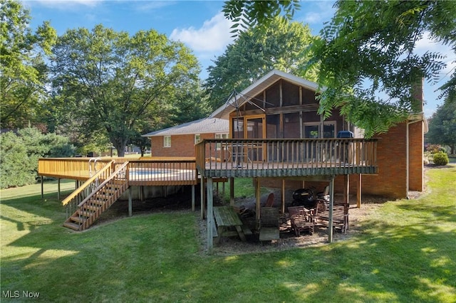 120 Vineyard Way, Doylestown, OH 44230 - back of property with a wooden deck, stairs, a lawn, and brick siding