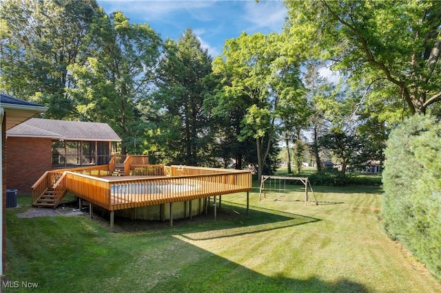 120 Vineyard Way, Doylestown, OH 44230 - view of green lawn featuring a deck and a sunroom