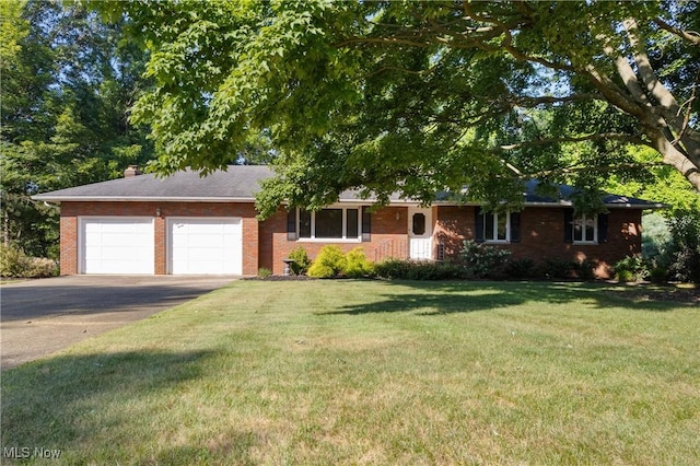 120 Vineyard Way, Doylestown, OH 44230 - view of front of property with a garage, driveway, brick siding, and a front yard