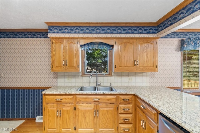 120 Vineyard Way, Doylestown, OH 44230 - kitchen with wallpapered walls, crown molding, stainless steel dishwasher, plenty of natural light, and light wood-type flooring