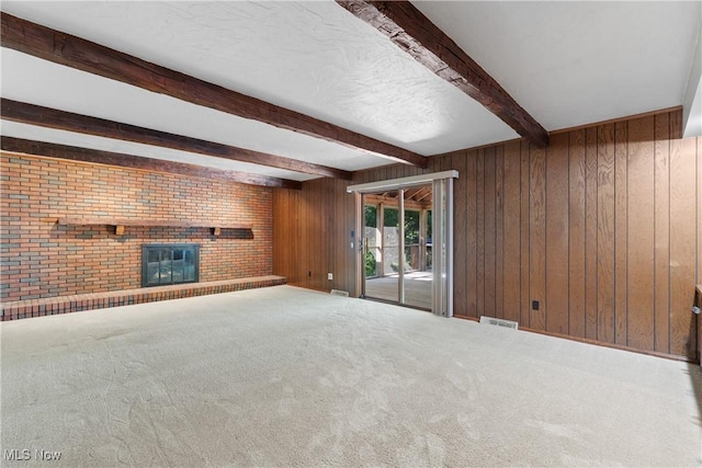 120 Vineyard Way, Doylestown, OH 44230 - unfurnished living room featuring a fireplace, beam ceiling, wood walls, and carpet floors