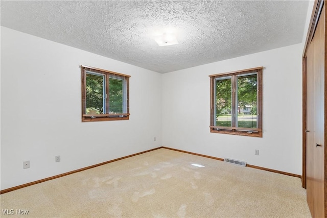 120 Vineyard Way, Doylestown, OH 44230 - carpeted spare room with baseboards and a textured ceiling