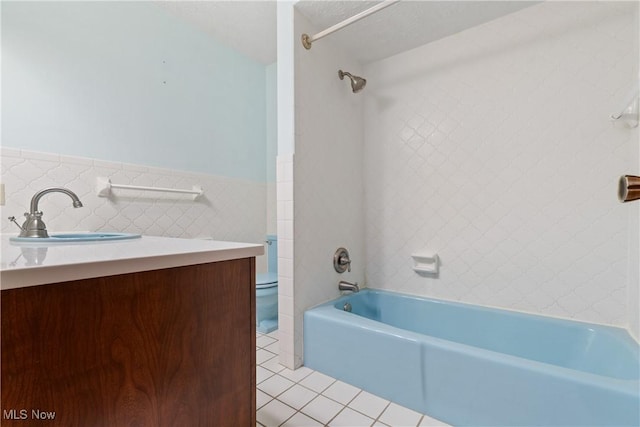 120 Vineyard Way, Doylestown, OH 44230 - full bath featuring tile walls, tile patterned floors, tub / shower combination, vanity, and a wainscoted wall