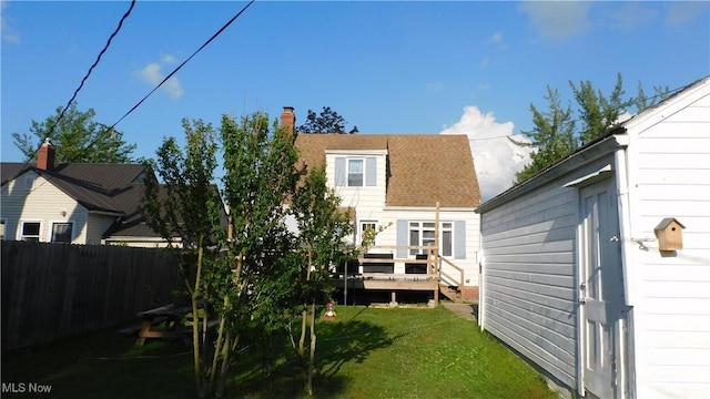 3233 Wilson Ave, Ashtabula, OH 44004 - rear view of property featuring a wooden deck and roof with shingles