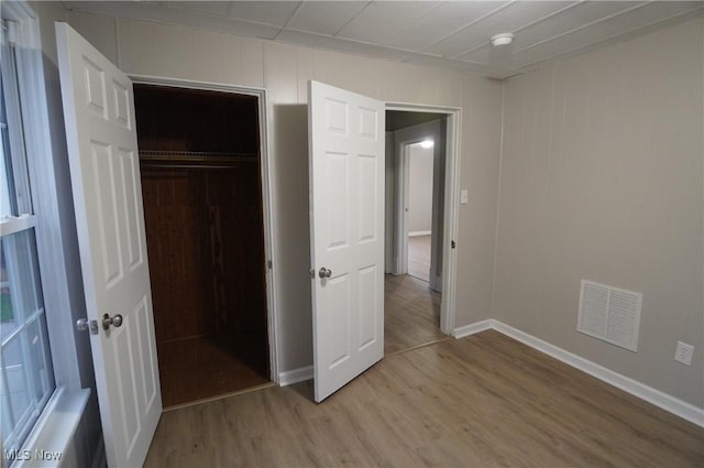 124 Peeler St, Mingo Junction, OH 43938 - unfurnished bedroom with light wood-type flooring and a closet