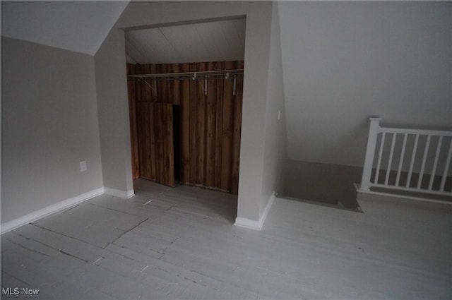 124 Peeler St, Mingo Junction, OH 43938 - unfurnished bedroom with vaulted ceiling, a closet, and wood finished floors