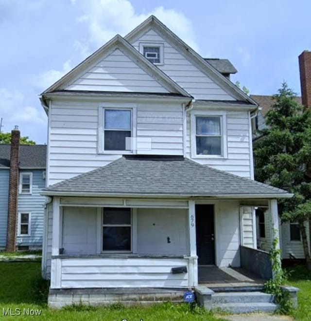 679 Wooster Rd W, Barberton, OH 44203 - view of front facade featuring a porch, roof with shingles, and a front lawn