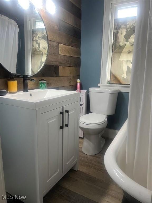 1540 Tanner Ave SW, Canton, OH 44706 - bathroom featuring wood walls, wood finished floors, and vanity