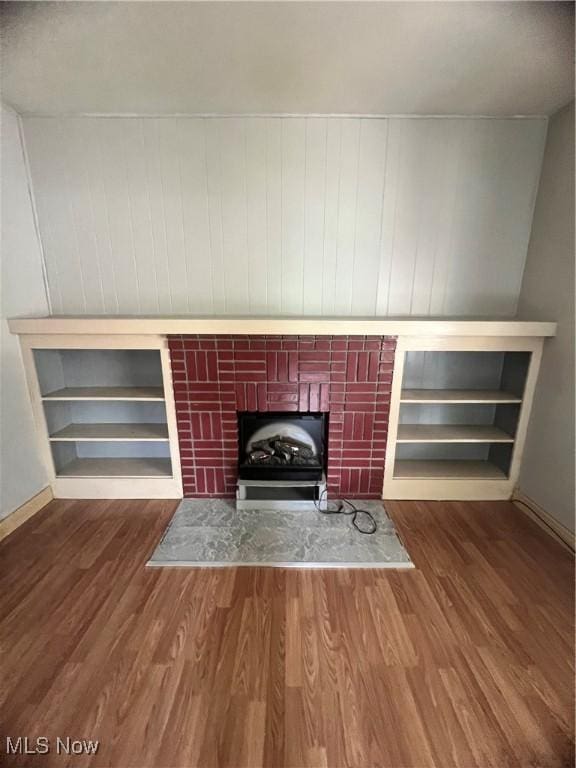 1370 Lee Ct SW, Canton, OH 44706 - detailed view of wood finished floors and a fireplace with raised hearth