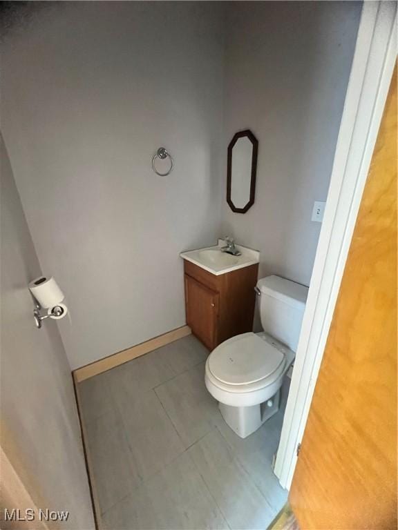 1370 Lee Ct SW, Canton, OH 44706 - half bathroom featuring tile patterned flooring and vanity