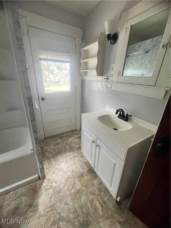 1370 Lee Ct SW, Canton, OH 44706 - full bath with vanity and shower / washtub combination