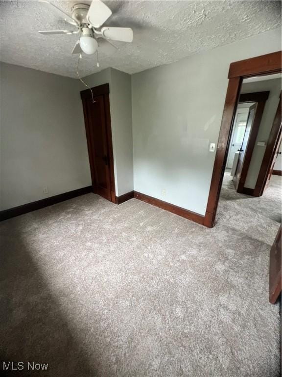 1370 Lee Ct SW, Canton, OH 44706 - unfurnished room featuring carpet, ceiling fan, and a textured ceiling