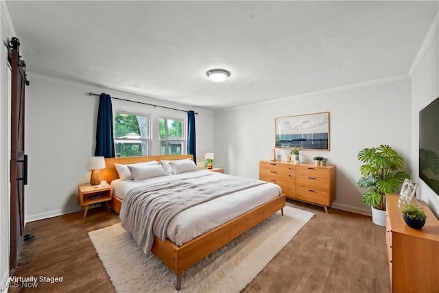 1361 Plainfield Rd, South Euclid, OH 44121 - bedroom with wood finished floors, ornamental molding, and a barn door