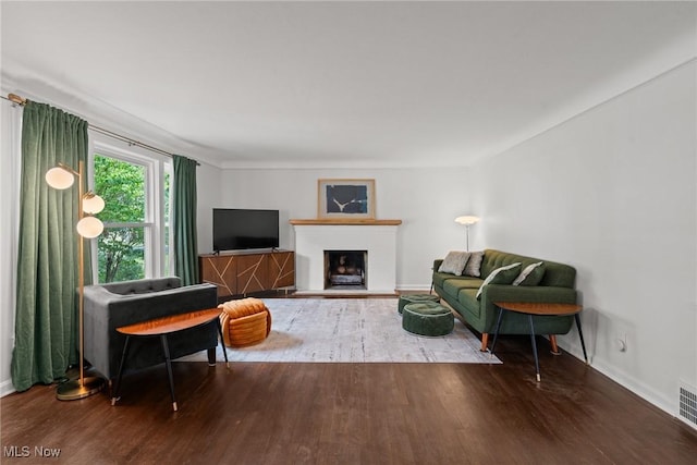1361 Plainfield Rd, South Euclid, OH 44121 - living room featuring wood finished floors and a fireplace with raised hearth