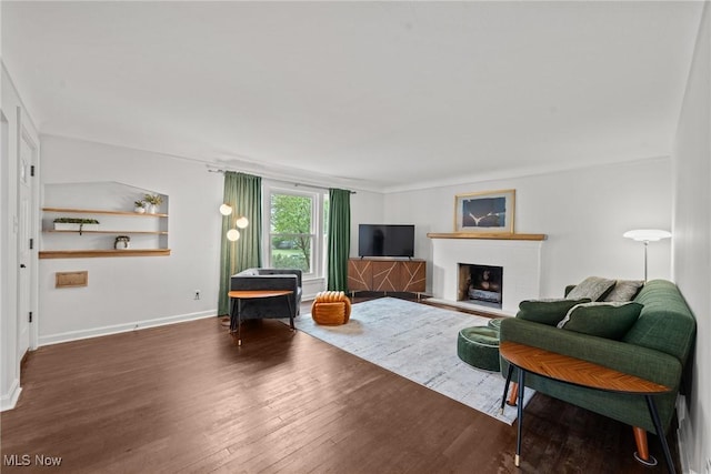 1361 Plainfield Rd, South Euclid, OH 44121 - living area with wood finished floors and a fireplace with raised hearth