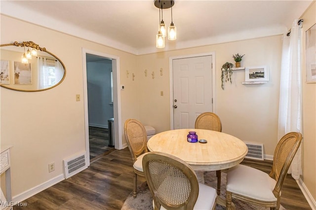 234 E 218th St, Euclid, OH 44123 - dining area featuring dark wood-style flooring and baseboards