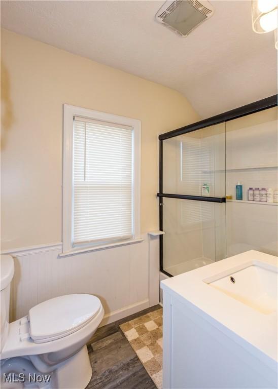 234 E 218th St, Euclid, OH 44123 - bathroom with a wainscoted wall, vanity, and wood finished floors