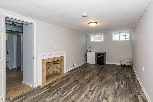 234 E 218th St, Euclid, OH 44123 - unfurnished living room with dark wood finished floors and a fireplace