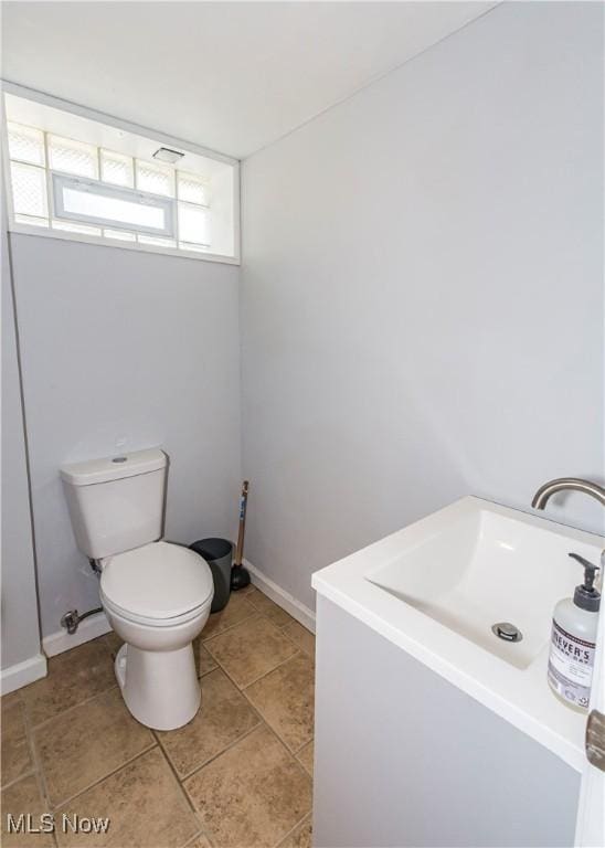 234 E 218th St, Euclid, OH 44123 - bathroom with toilet and tile patterned floors