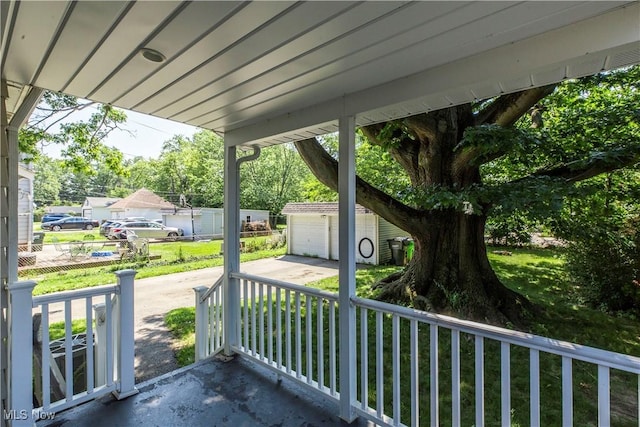 234 E 218th St, Euclid, OH 44123 - view of patio with an outbuilding and a garage