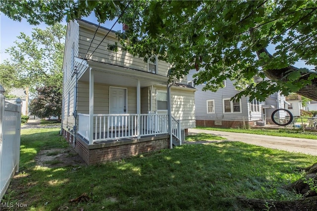 234 E 218th St, Euclid, OH 44123 - view of front of property featuring covered porch and a front lawn